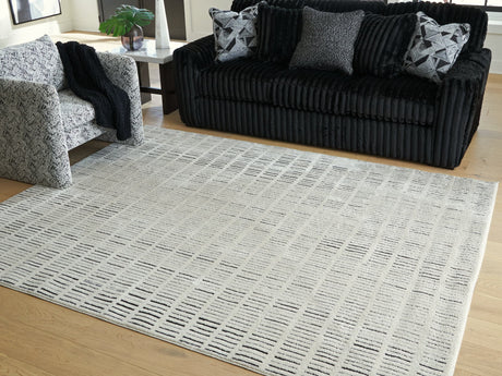 Turinwith Ivory and Black Striped Area Rug laid flat
