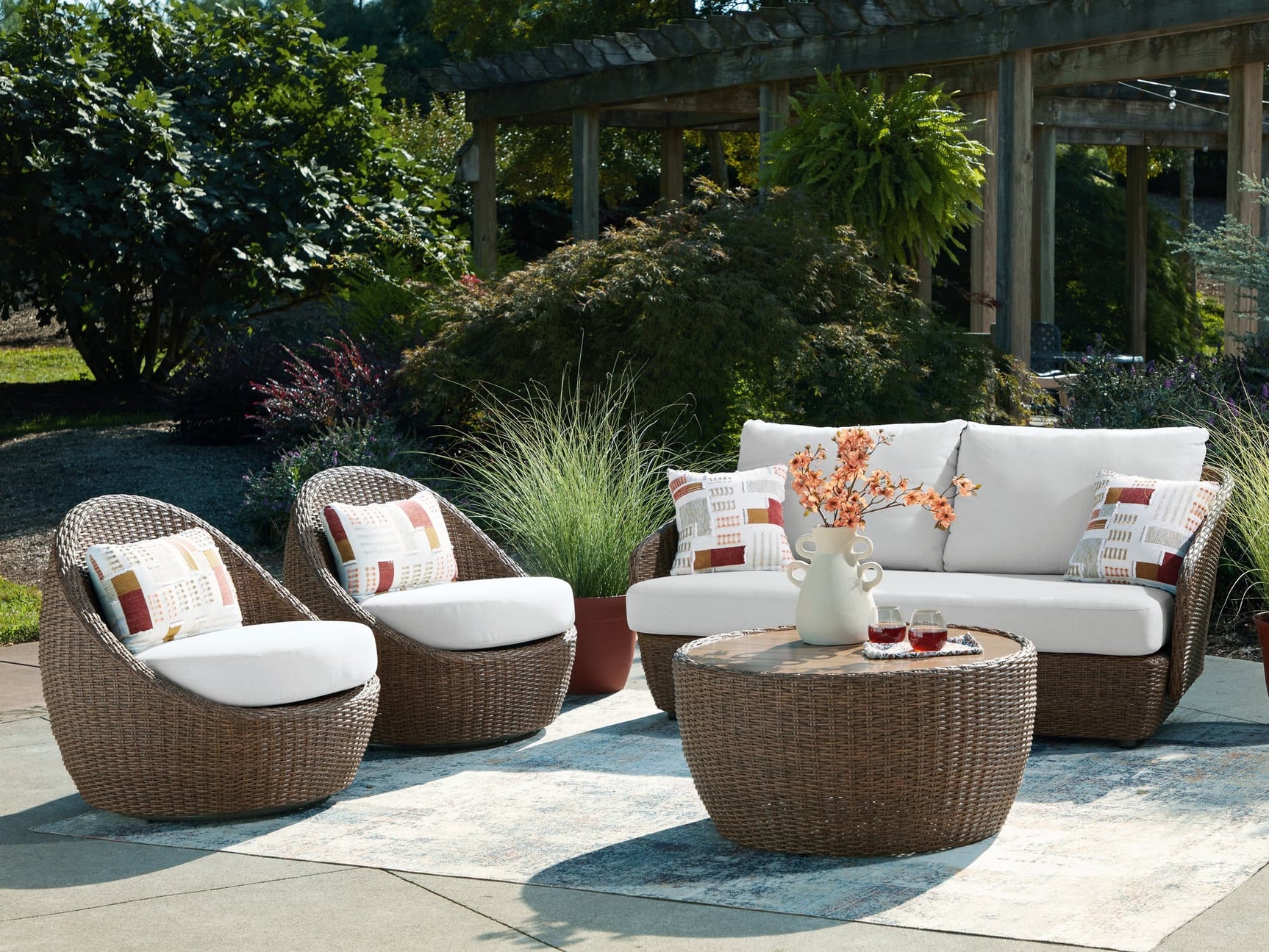 Double beige outdoor sofa set with matching loveseat and lounge chairs