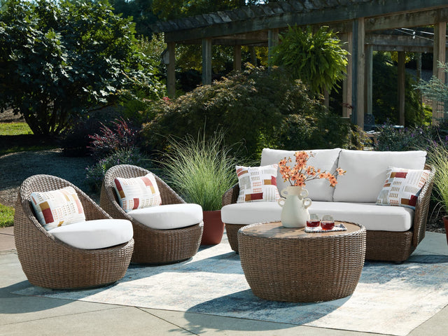 Double beige outdoor sofa set with matching loveseat and lounge chairs