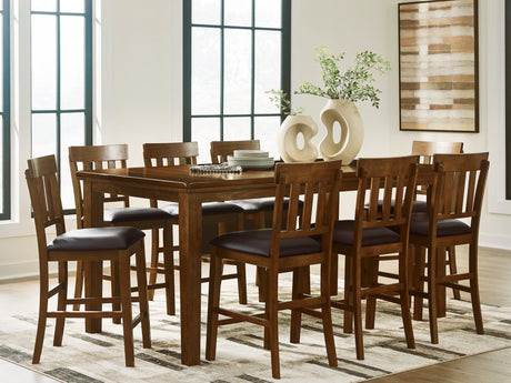 Ralene medium brown counter height dining table with eight faux leather barstools front view
