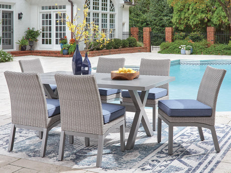 Half Gray Moon Beach outdoor dining table with 6 chairs, angled view