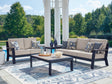 Outdoor navy blue sofa and loveseat with driftwood coffee table, front view