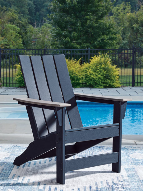 East Beach Adirondack Chair angled side view showing navy blue seat and driftwood arms