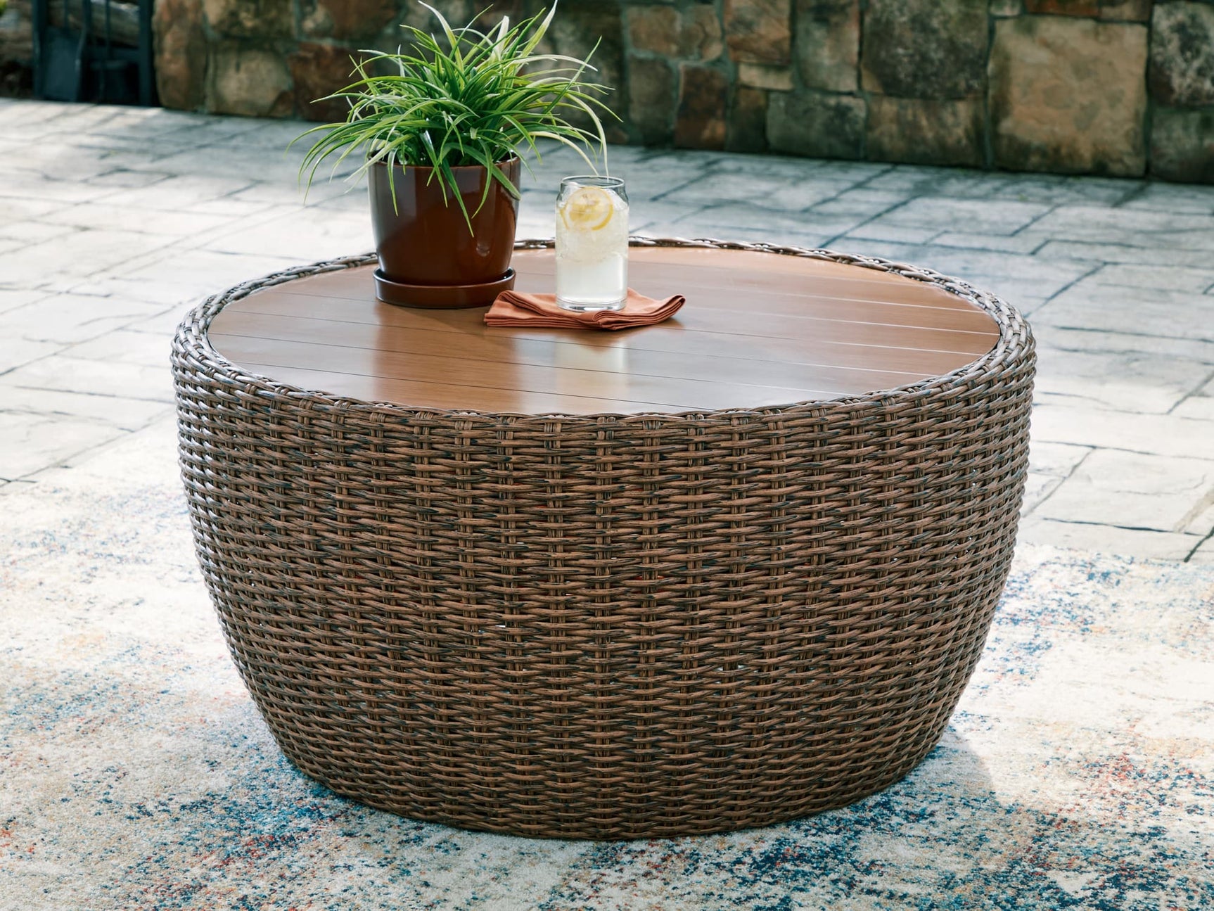 Double Point Beige Outdoor Coffee Table, front view showing woven resin wicker and hand-brushed tabletop