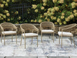 Orchard Beach beige outdoor arm chair with cushion, front angle