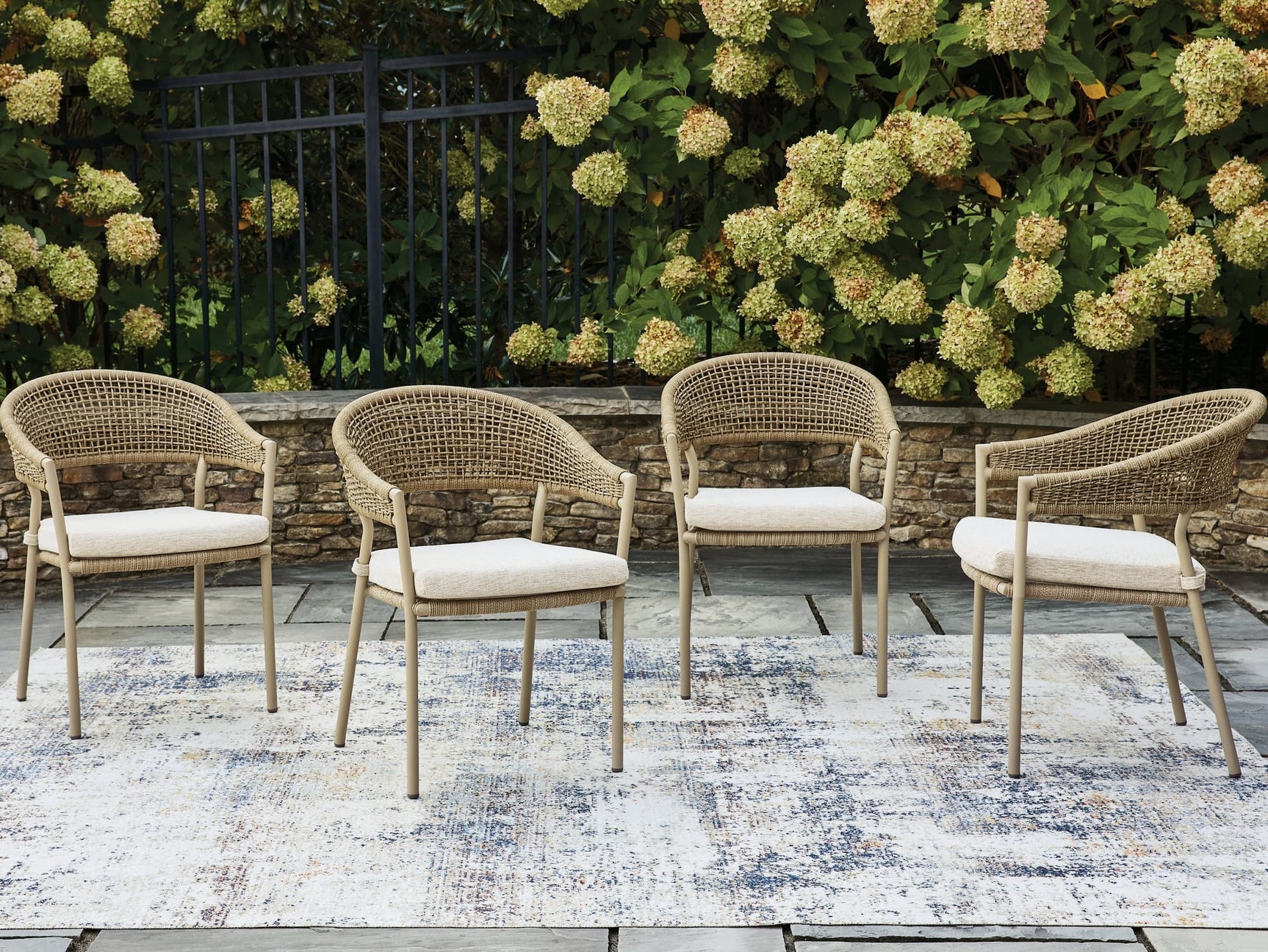 Orchard Beach beige outdoor arm chair with cushion, front angle