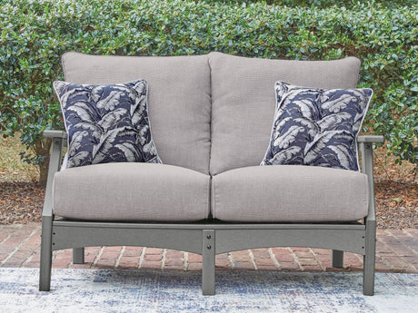 Cove Beach gray outdoor loveseat with cushions front angle