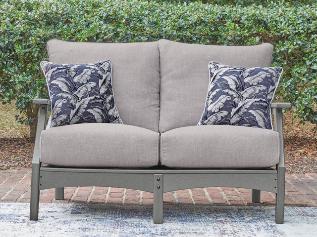 Cove Beach gray outdoor loveseat with cushions front angle