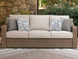 Laguna Heights beige outdoor sofa with cushions, angled front view