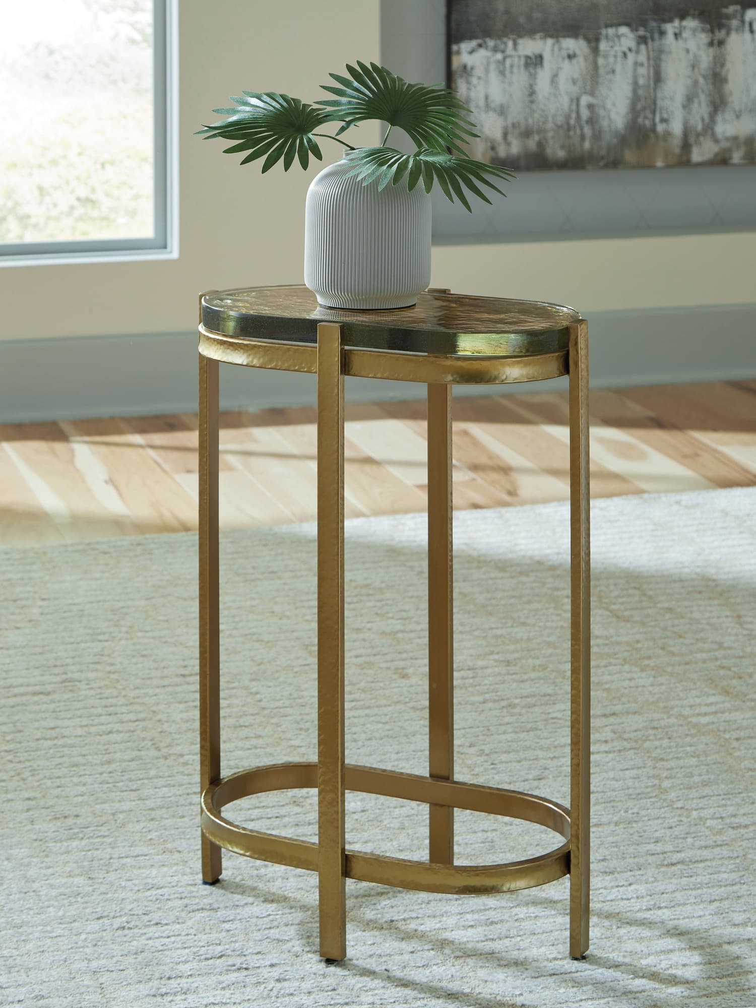 Porterville gold finish accent table angled view showing glass top and metal frame