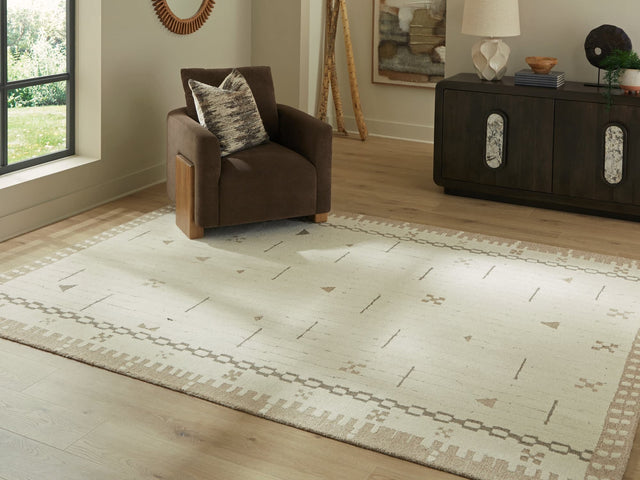 Dot area rug 7'8" x 10' with cream, brown, and taupe geometric border pattern