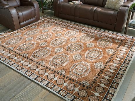 Qaabiz 7'8" x 10' area rug in sienna, ivory, and black medallion pattern