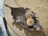 Avermund sculpture angled view showing leaf design