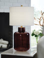 Mette table lamp with brown glass base and goldtone accents front view