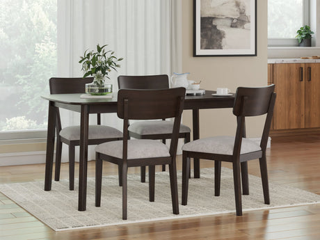 Mallenette Merlot dining table with four upholstered chairs front view