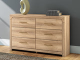 Kinlanni Tan Dresser front view showing 6 drawers