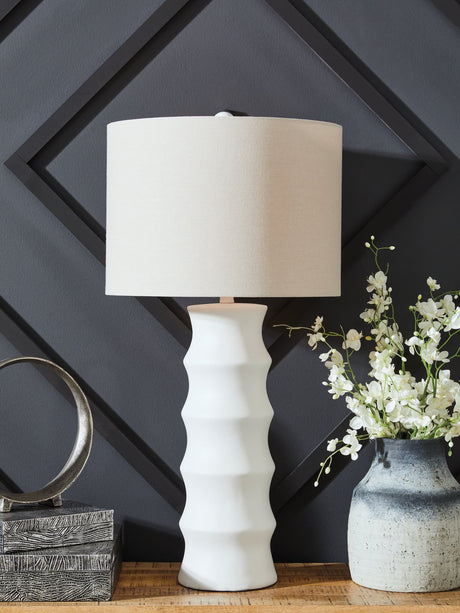 Veraleigh white table lamp with scalloped polyresin base and white fabric drum shade, front angle