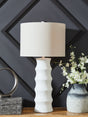 Veraleigh white table lamp with scalloped polyresin base and white fabric drum shade, front angle