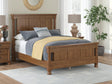 Rowlenstown Brown Queen Poster Bed, front view showing poster headboard and footboard