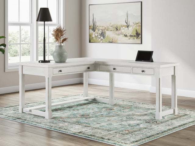 Robbinsdale Antique White L-Shaped Home Office Desk front view