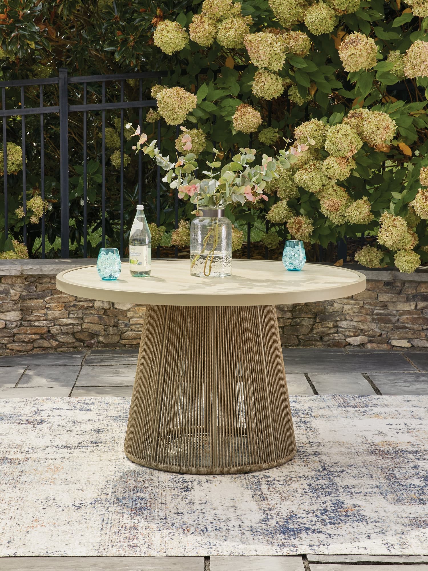 Orchard Beach Beige Outdoor Dining Table, front angle showing full tabletop