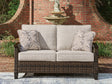 Monterey Point dark brown resin wicker outdoor loveseat with cushions, front angle