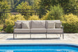 Ocean Beach gray outdoor sofa front angled view with cushions