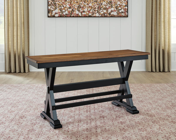 Wildenauer 48" counter height bench showing side angle with brown seat and black frame