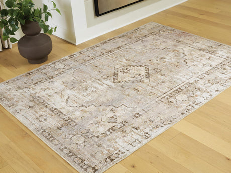 Livdon medium washable rug with traditional medallion design in brown, beige, and gray