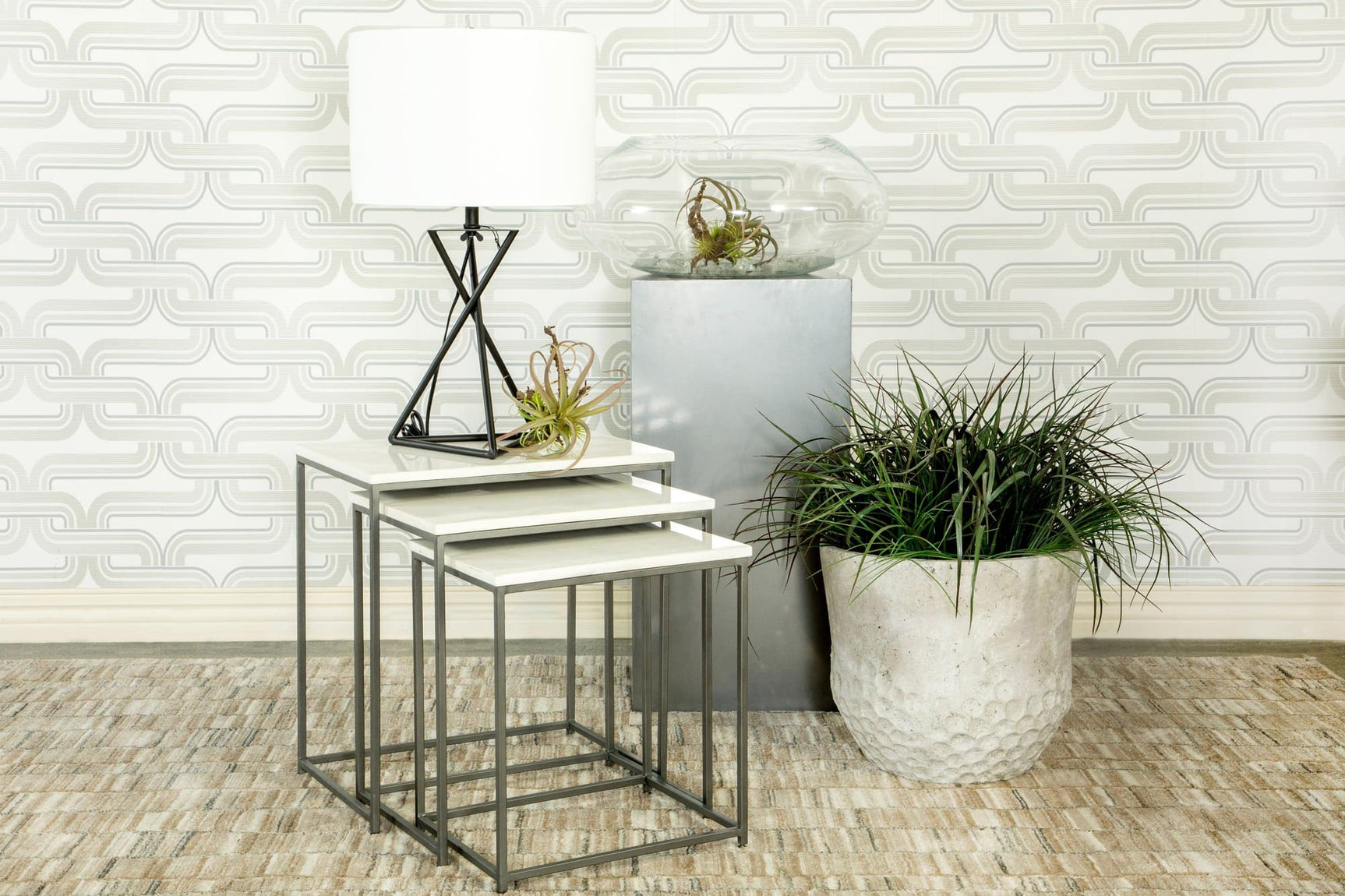 Caine nesting tables with white marble tops shown nested