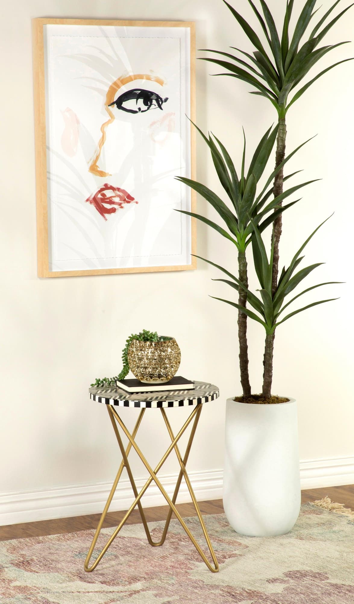 Xenia round accent table showing black and white bone inlay mosaic top