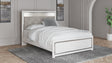 Altyra White Queen Panel Bed angled view showing headboard and footboard