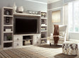 Willowton Whitewash 4-Piece Entertainment Center front view showing TV stand and piers