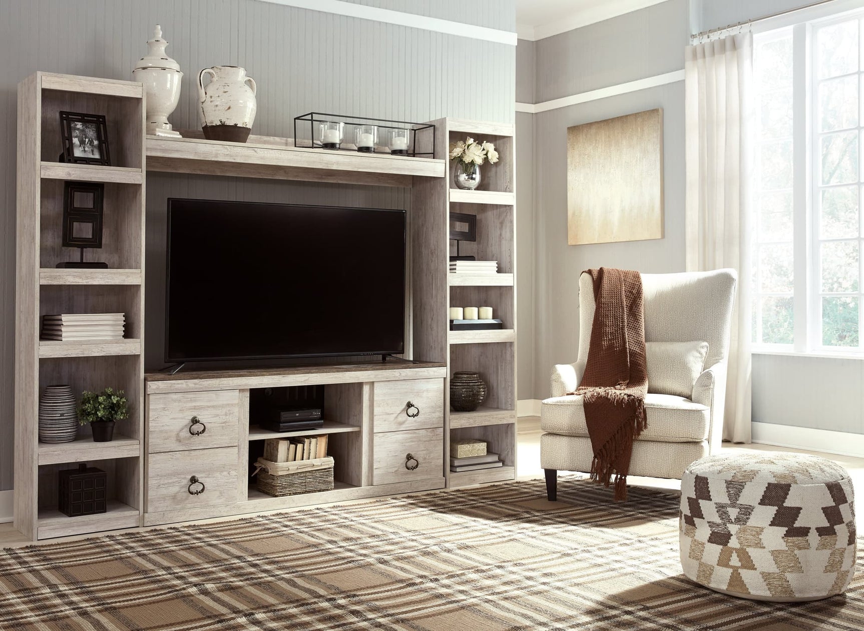 Willowton Whitewash 4-Piece Entertainment Center front view showing TV stand and piers