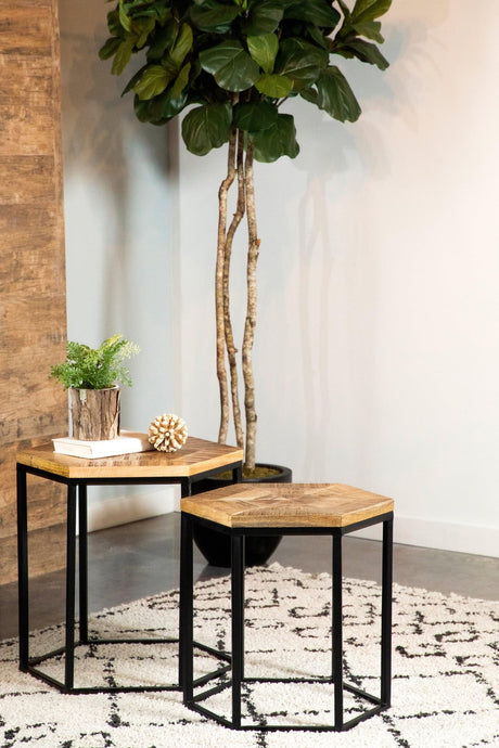 Adger 2-piece hexagon nesting tables top view showing natural mango wood finish and black iron frame