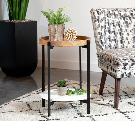 Adhvik round accent table showing natural mango wood top and black iron frame