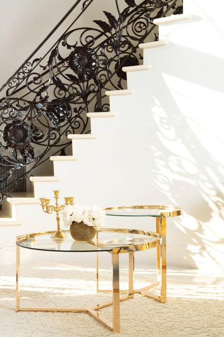 Delia 2-piece round nesting tables with clear glass tops and gold bases, front view