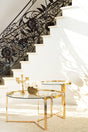 Delia 2-piece round nesting tables with clear glass tops and gold bases, front view