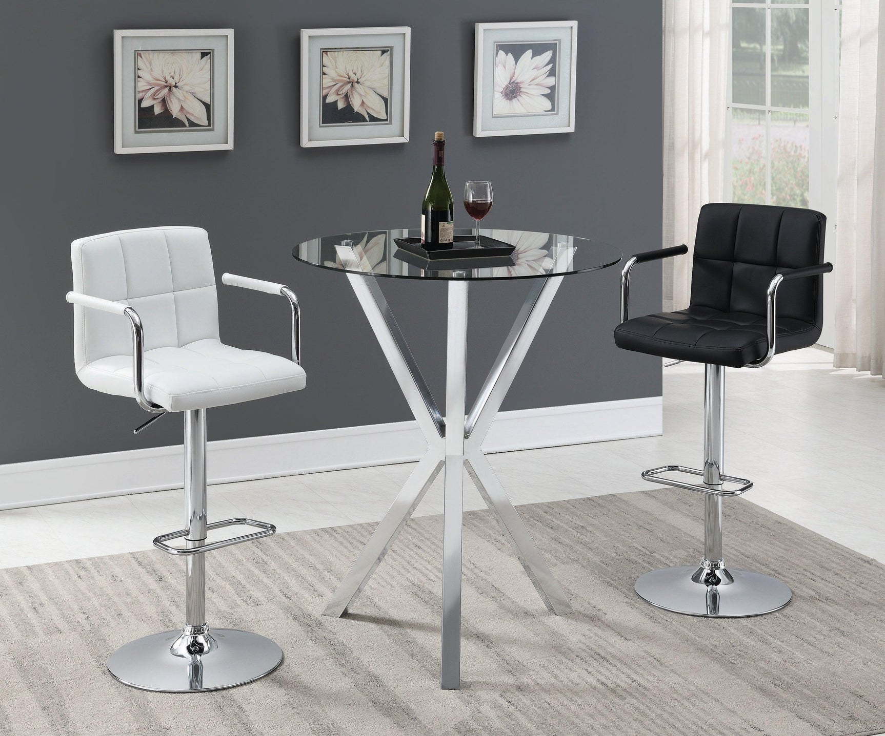 Close-up of polished chrome steel frame and tempered glass top