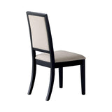 Close-up of cream upholstered dining chair cushion and black wood legs