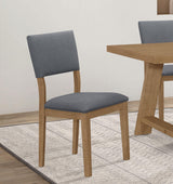 Grey upholstered dining arm chair side view