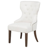Close-up of Baney chair wingback backrest and rolled arm