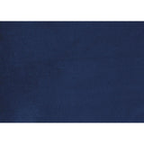 Urielle navy blue velvet chair among room setting