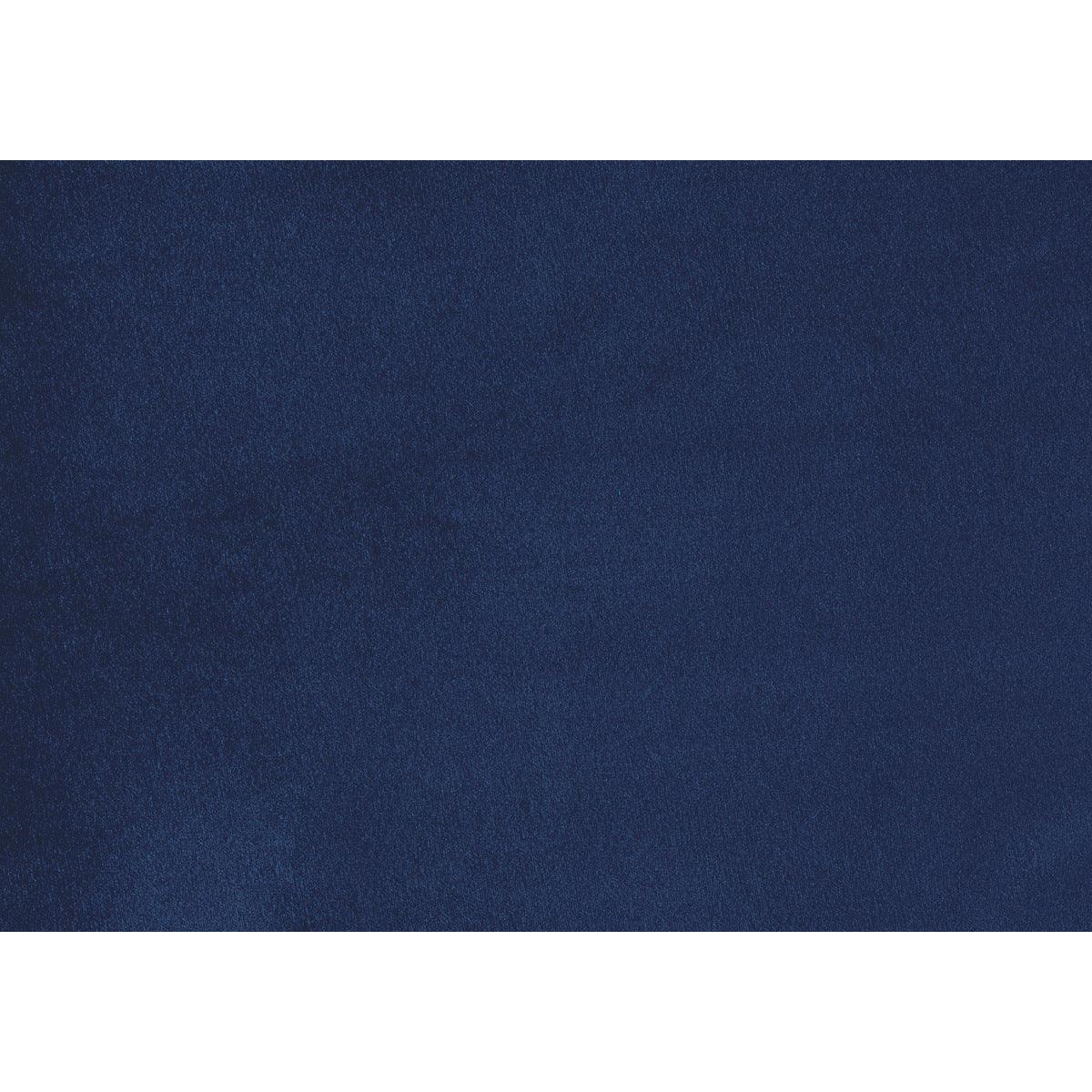 Urielle navy blue velvet chair among room setting