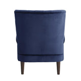 Close-up of navy velvet fabric and wood leg detail