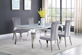 Closeup of plush grey velvet seat and chrome legs of Betty dining chair
