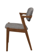 Close-up of grey fabric upholstery and walnut finish on Malone dining chair