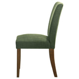Cantley green dining chair angled in room setting