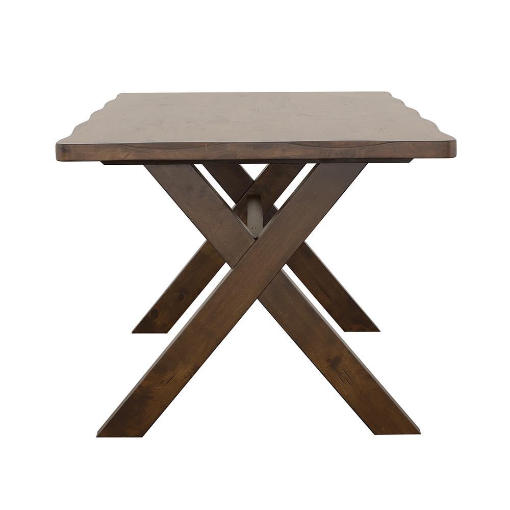 Close-up of Alston dining table X-shaped base in Knotty Nutmeg finish