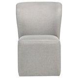 Jaelynn dining side chair close-up showing upholstery and caster
